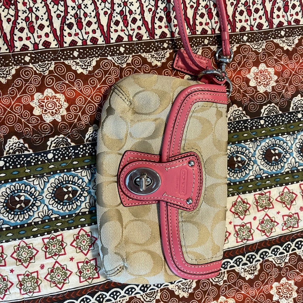 Coach wristlet - pink trim.